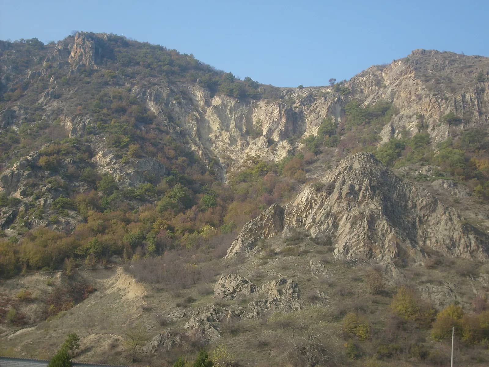Volcanic rock and trees on the hills around Rupite