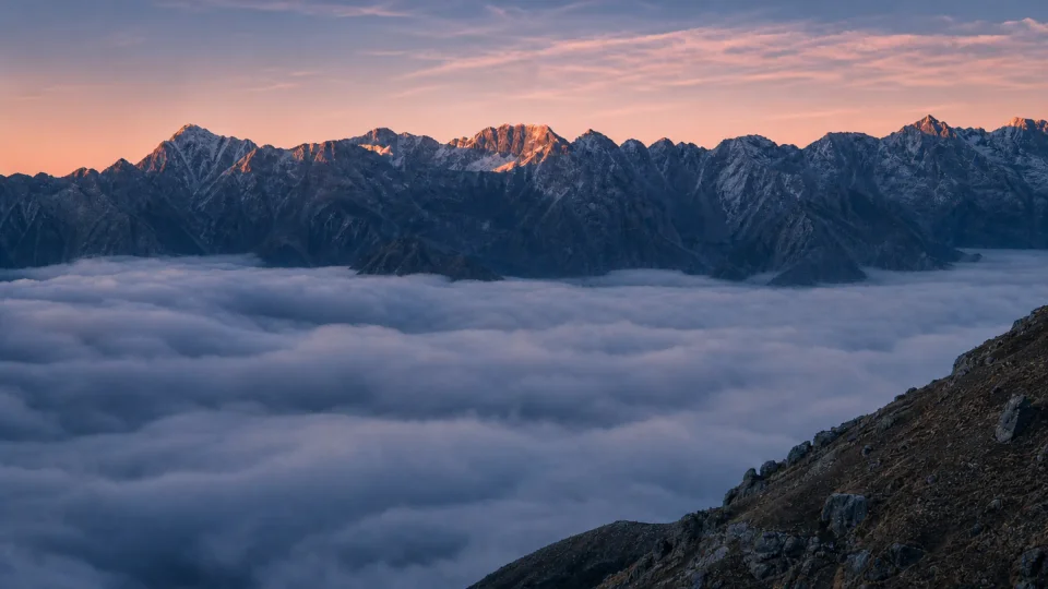 Himalayan peaks above a sea of cloud at dawn